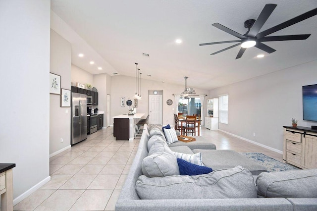 living area with recessed lighting, light tile patterned floors, a ceiling fan, baseboards, and lofted ceiling