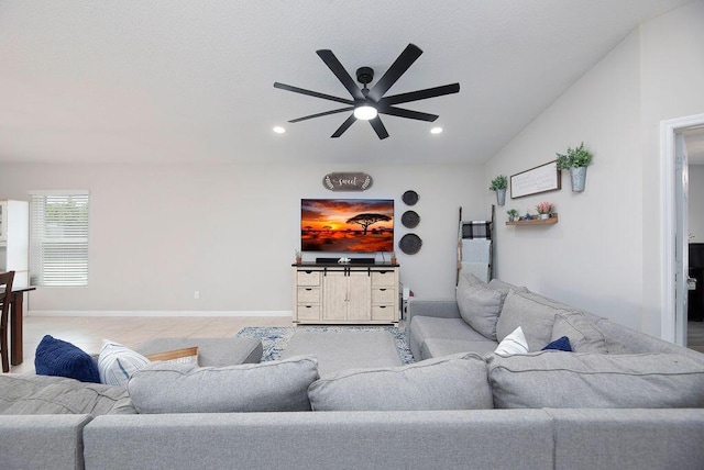 living area featuring recessed lighting, a ceiling fan, vaulted ceiling, and baseboards