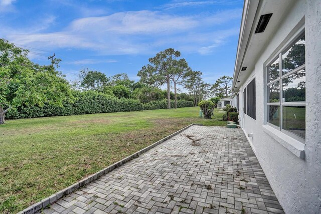 view of yard with a patio area