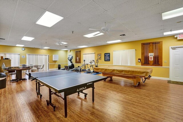 game room featuring billiards, ceiling fan, wood finished floors, and a paneled ceiling