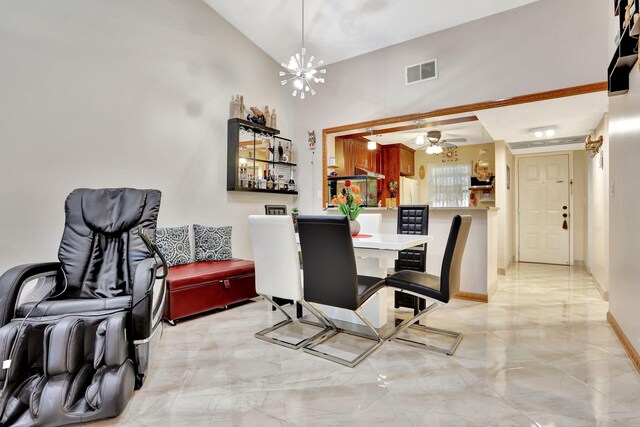 dining space featuring ceiling fan, marble finish floor, visible vents, vaulted ceiling, and baseboards