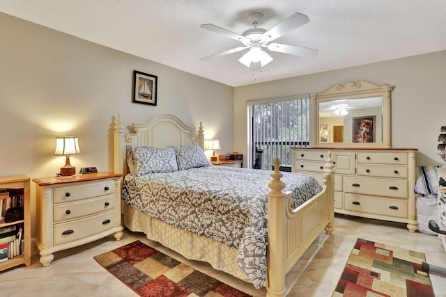 bedroom featuring a textured ceiling, a ceiling fan, and marble finish floor