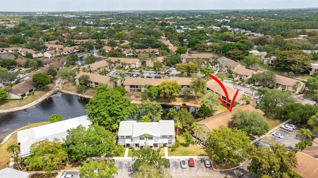 birds eye view of property with a residential view and a water view
