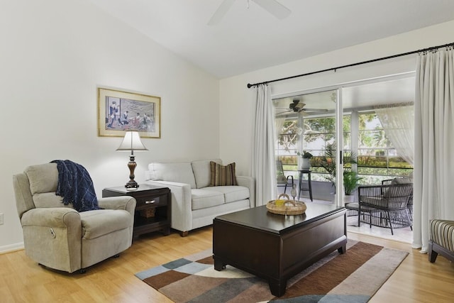 1054 NW Tuscany Dr, Port Saint Lucie, FL 34986 - living area featuring lofted ceiling, light wood-type flooring, and a ceiling fan