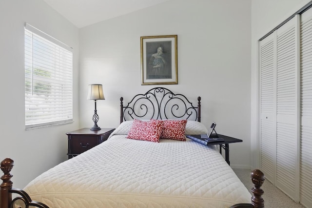 1054 NW Tuscany Dr, Port Saint Lucie, FL 34986 - carpeted bedroom with multiple windows, lofted ceiling, and a closet