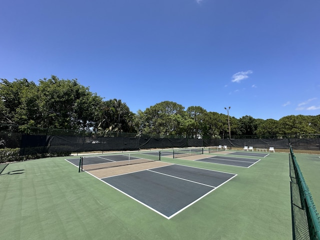 1054 NW Tuscany Dr, Port Saint Lucie, FL 34986 - view of sport court featuring community basketball court and fence