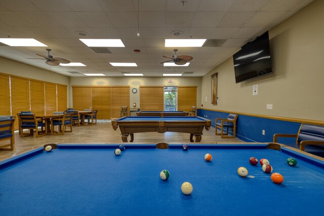 1054 NW Tuscany Dr, Port Saint Lucie, FL 34986 - playroom with wood finished floors, billiards, a ceiling fan, and a drop ceiling