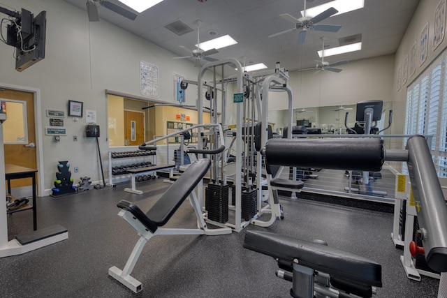 1054 NW Tuscany Dr, Port Saint Lucie, FL 34986 - exercise room featuring a towering ceiling, ceiling fan, and a paneled ceiling