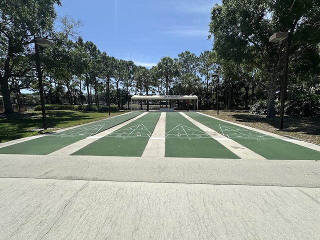 1054 NW Tuscany Dr, Port Saint Lucie, FL 34986 - surrounding community featuring a yard and shuffleboard