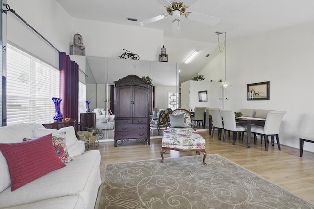 1054 NW Tuscany Dr, Port Saint Lucie, FL 34986 - living area with high vaulted ceiling, wood finished floors, and ceiling fan