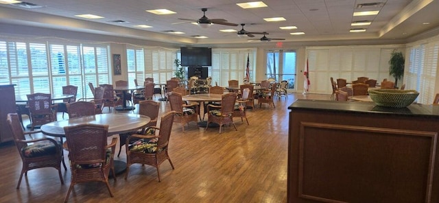 2006 S Federal Hwy S Unit 102, Boynton Beach, FL 33435 - dining room featuring a ceiling fan, a tray ceiling, and a wealth of natural light