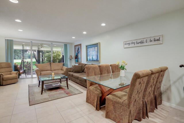 bedroom with baseboards, ceiling fan, and light tile patterned floors