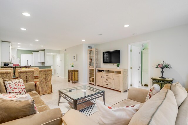 bedroom featuring baseboards, a ceiling fan, and light tile patterned floors