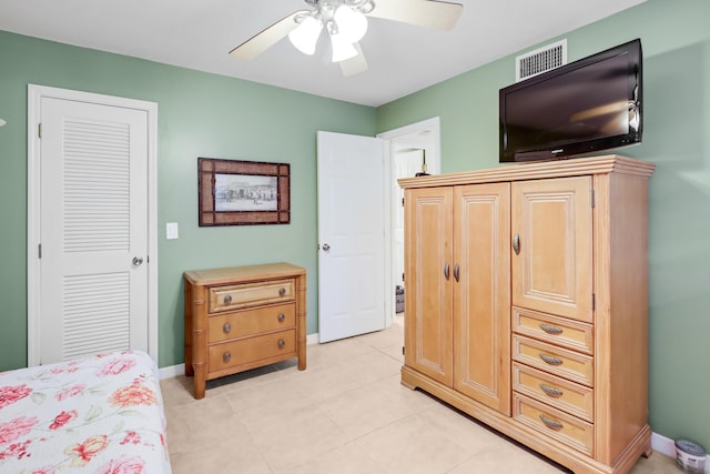4801 Esedra Ct Unit 104, Lake Worth, FL 33467 - bedroom with visible vents, a ceiling fan, baseboards, and light tile patterned floors