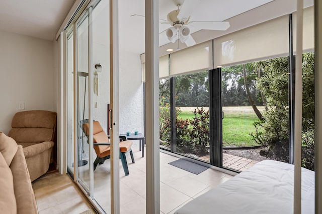 4801 Esedra Ct Unit 104, Lake Worth, FL 33467 - doorway with plenty of natural light, a ceiling fan, and light tile patterned flooring