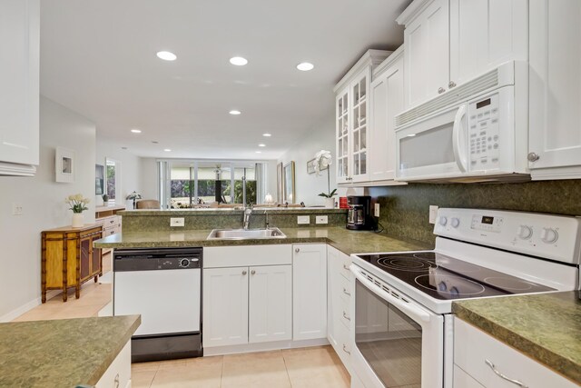 dining room featuring light tile patterned floors, baseboards, recessed lighting, and expansive windows