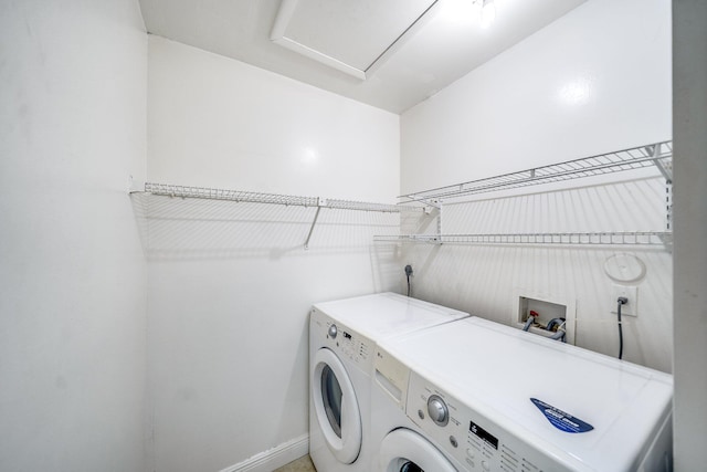 laundry area featuring baseboards, washing machine and clothes dryer, and laundry area