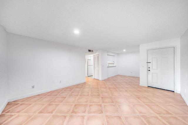 interior space featuring recessed lighting, visible vents, and baseboards