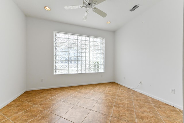 tiled empty room with a ceiling fan, recessed lighting, and baseboards