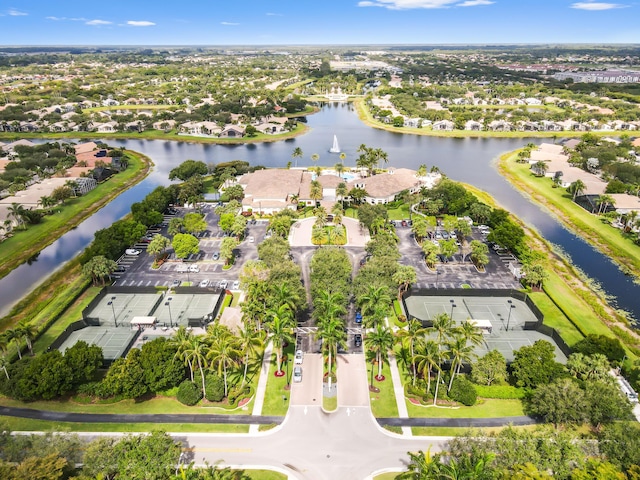 aerial perspective of suburban area with a nearby body of water
