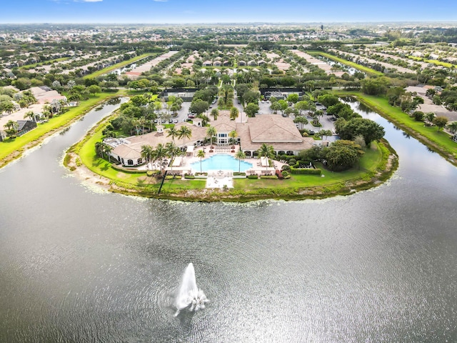 aerial view of residential area with a pool area and a nearby body of water