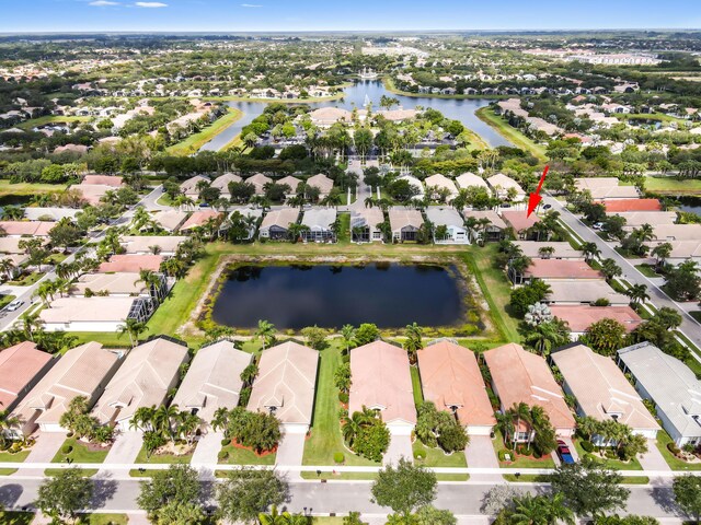 aerial overview of property's location featuring nearby suburban area and a large body of water