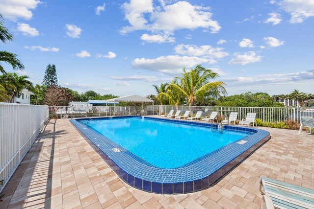 4201 S Ocean Blvd Unit I1, Palm Beach, FL 33480 - pool featuring fence and a patio
