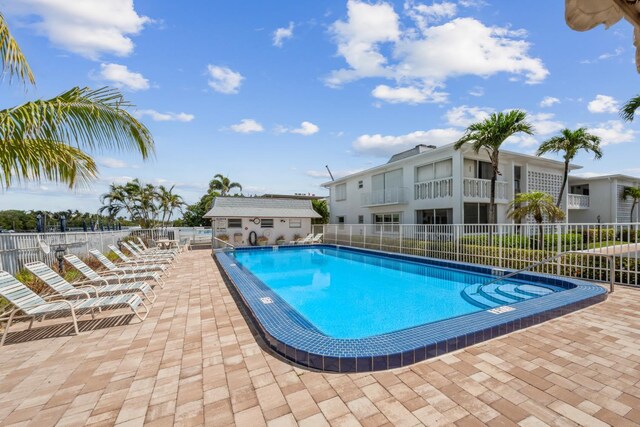 4201 S Ocean Blvd Unit I1, Palm Beach, FL 33480 - pool featuring fence, a patio, and an outdoor structure
