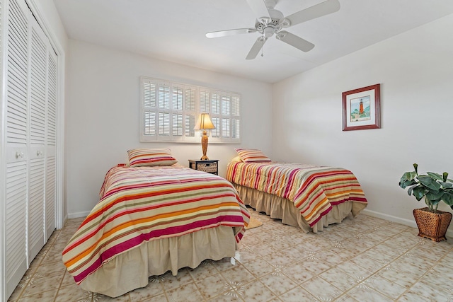 bedroom featuring baseboards, a ceiling fan, and a closet