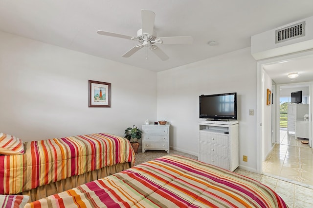 bedroom with visible vents, baseboards, and ceiling fan