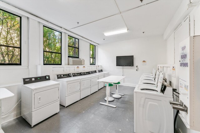 235 Sunrise Ave Unit 1051, Palm Beach, FL 33480 - shared laundry area with baseboards, cooling unit, and washing machine and clothes dryer