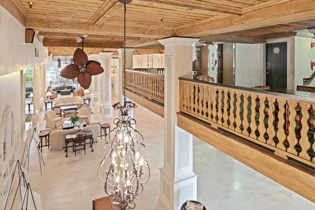 235 Sunrise Ave Unit 1051, Palm Beach, FL 33480 - interior space with ornate columns, beamed ceiling, wood ceiling, and tile patterned floors