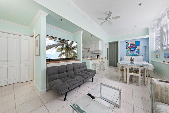 235 Sunrise Ave Unit 1051, Palm Beach, FL 33480 - living area with light tile patterned flooring, ceiling fan, ornamental molding, and baseboards