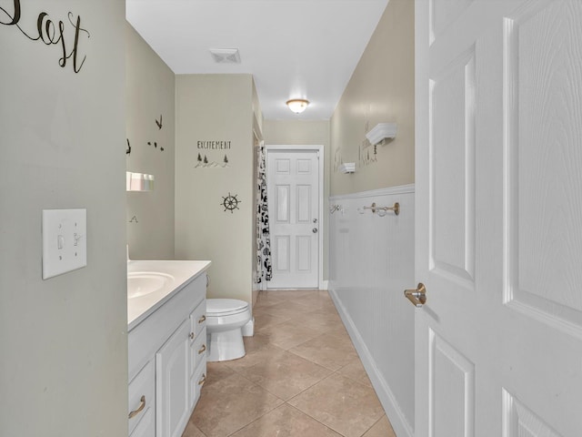 bathroom with visible vents, tile patterned flooring, vanity, toilet, and a shower with shower curtain