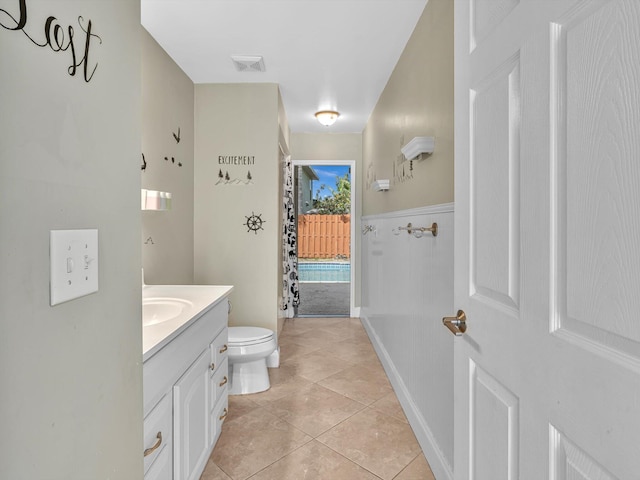 bathroom with vanity, tile patterned floors, visible vents, and toilet