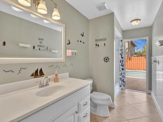 full bath featuring visible vents, shower / tub combination, vanity, tile patterned floors, and toilet