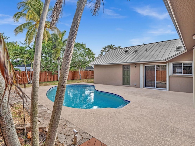 view of pool featuring a fenced in pool, a fenced backyard, and a patio area