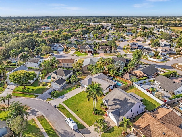 birds eye view of property with a residential view