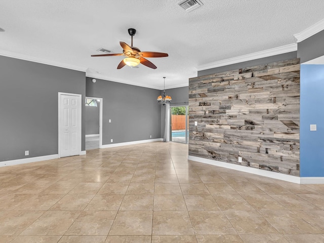 tiled empty room featuring crown molding, a textured ceiling, an accent wall, ceiling fan with notable chandelier, and visible vents
