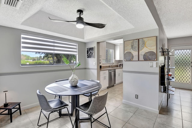 15108 Ashland Dr Unit 185, Delray Beach, FL 33484 - dining room with a textured ceiling, light tile patterned floors, visible vents, ceiling fan, and baseboards
