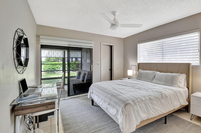 15108 Ashland Dr Unit 185, Delray Beach, FL 33484 - bedroom featuring a textured ceiling, ceiling fan, and tile patterned flooring