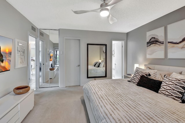 15108 Ashland Dr Unit 185, Delray Beach, FL 33484 - bedroom featuring visible vents, ceiling fan, and light carpet