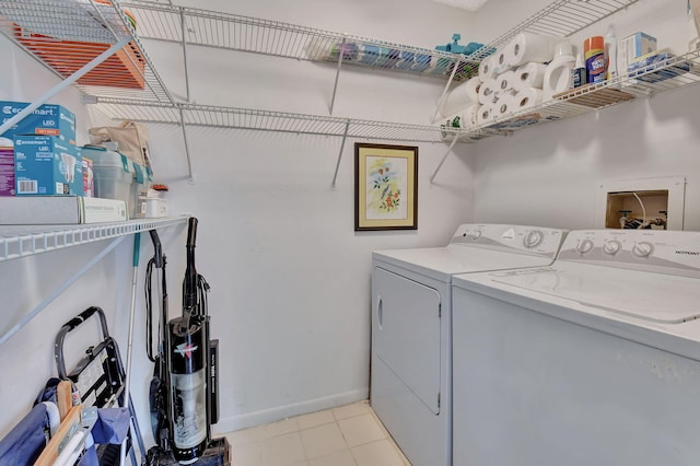 15108 Ashland Dr Unit 185, Delray Beach, FL 33484 - laundry room featuring baseboards, separate washer and dryer, and laundry area