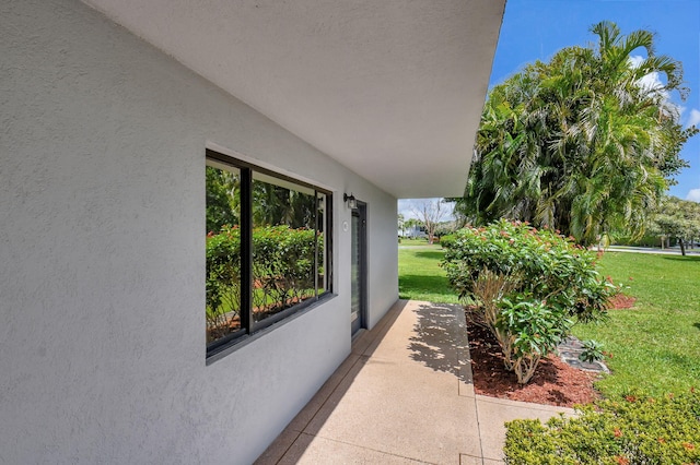 15108 Ashland Dr Unit 185, Delray Beach, FL 33484 - exterior space with stucco siding and a lawn