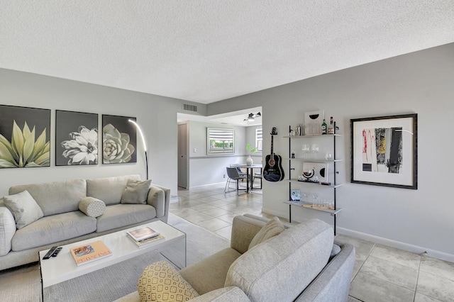 15108 Ashland Dr Unit 185, Delray Beach, FL 33484 - tiled living area featuring a textured ceiling, visible vents, and baseboards