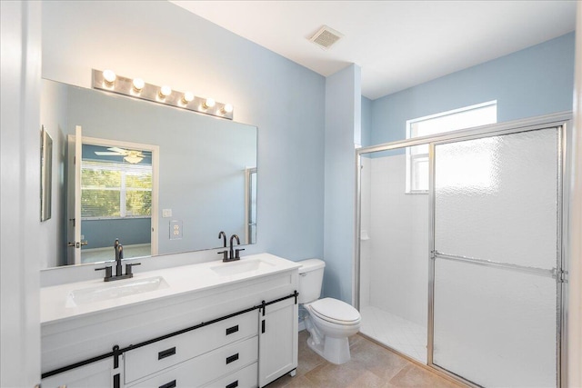 9925 SW Stonegate Dr, Port Saint Lucie, FL 34987 - bathroom featuring double vanity, toilet, and a shower stall