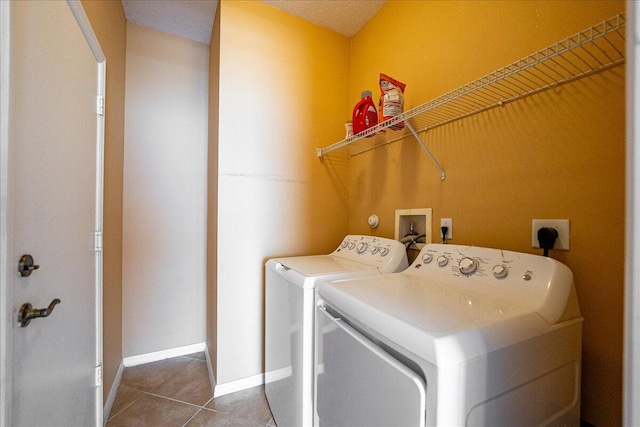 9925 SW Stonegate Dr, Port Saint Lucie, FL 34987 - washroom with independent washer and dryer, tile patterned floors, and baseboards