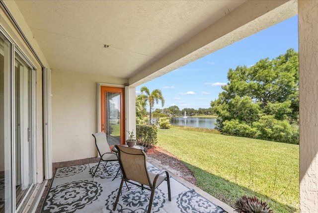 9925 SW Stonegate Dr, Port Saint Lucie, FL 34987 - view of patio / terrace with a water view