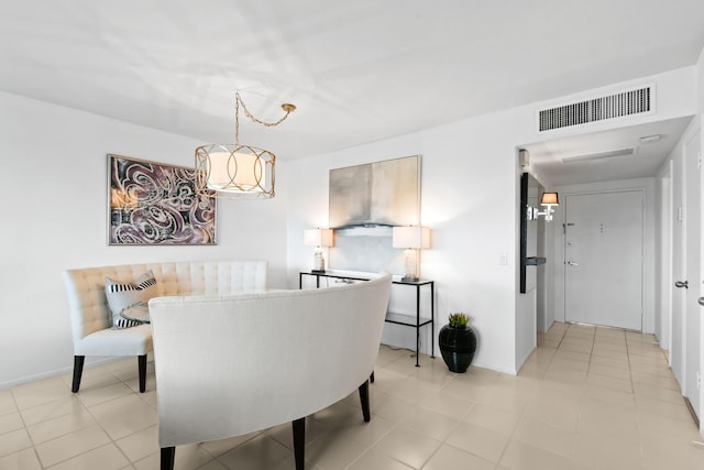 dining space featuring light tile patterned floors, baseboards, and visible vents