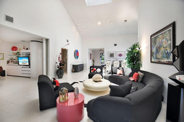 14 Windsor Ln, Boynton Beach, FL 33436 - living area featuring high vaulted ceiling, tile patterned flooring, and a skylight